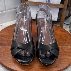 Söfft black leather sling-back wedge sandals.